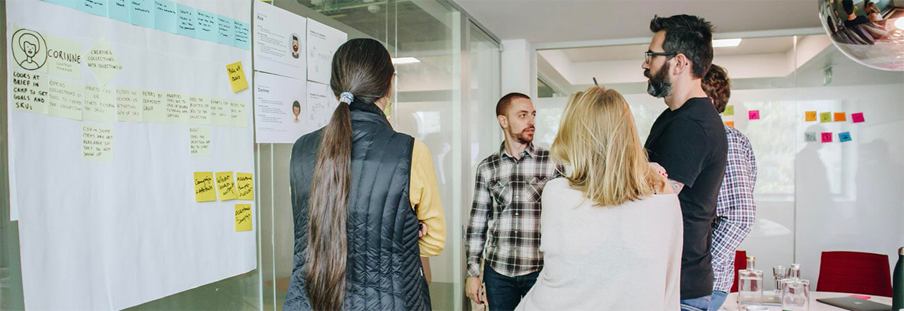 A group of people talking during a design workshop